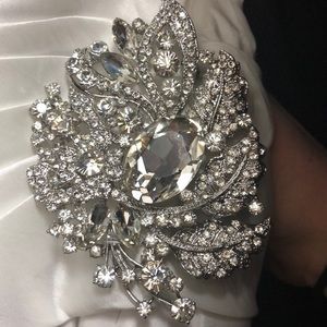 Beautiful wedding dress with broach and lace back